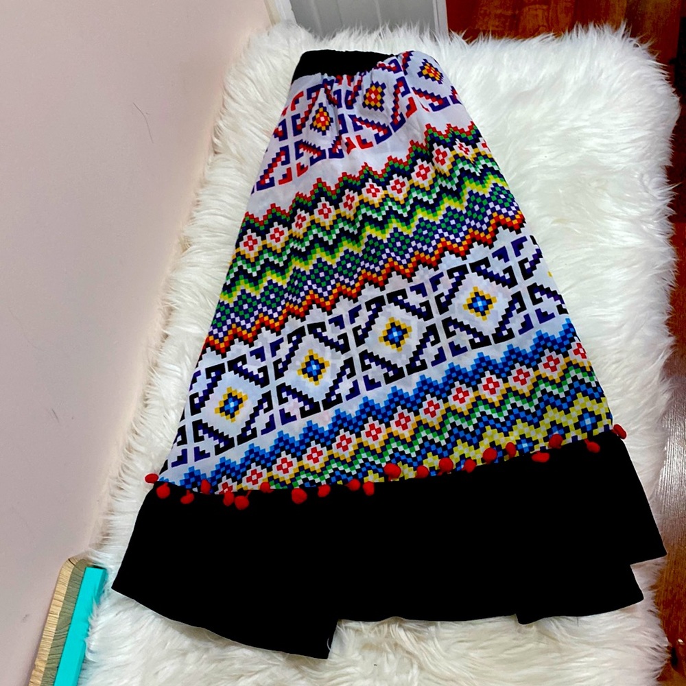 Vintage size 16 circle skirt with tribal patterns.
